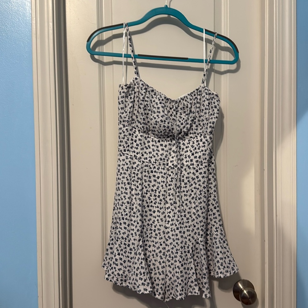 White Navy Floral Romper with flowy shorts